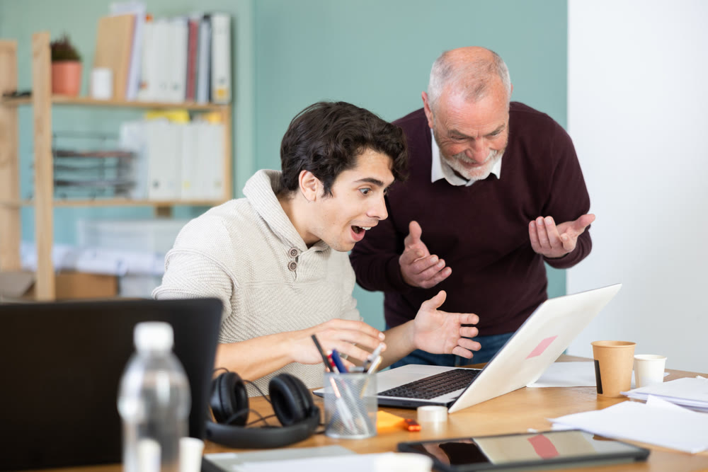 Men office employees is genuinely happy and elated