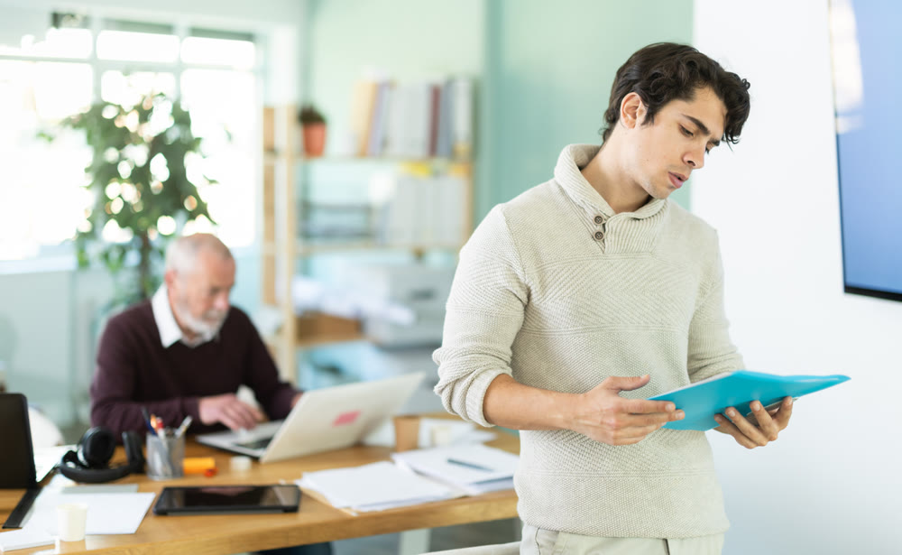 Guy office male employee read documents