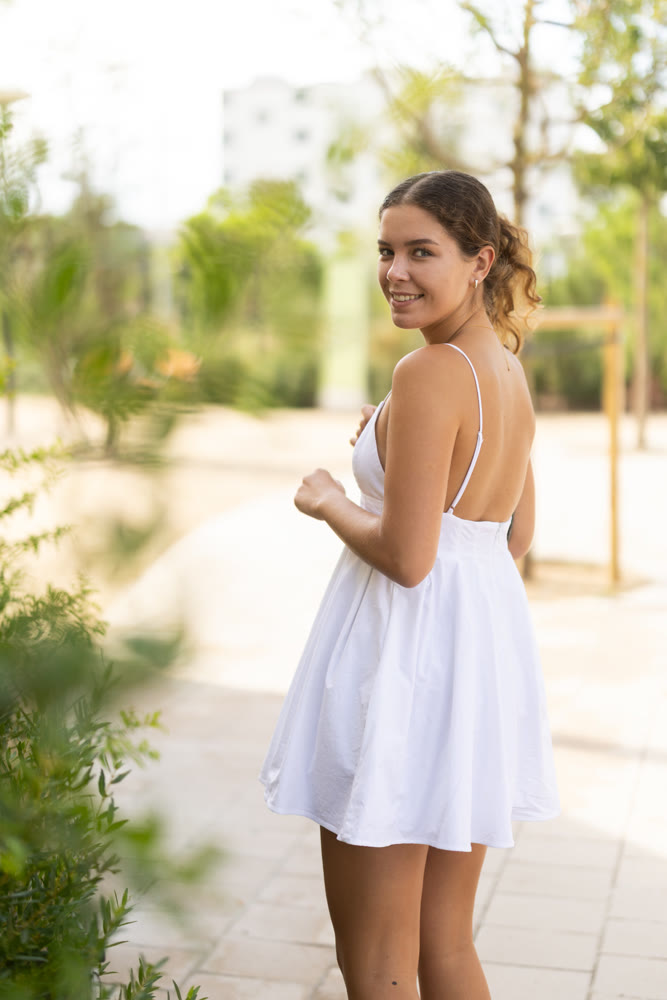Young woman walking in city park