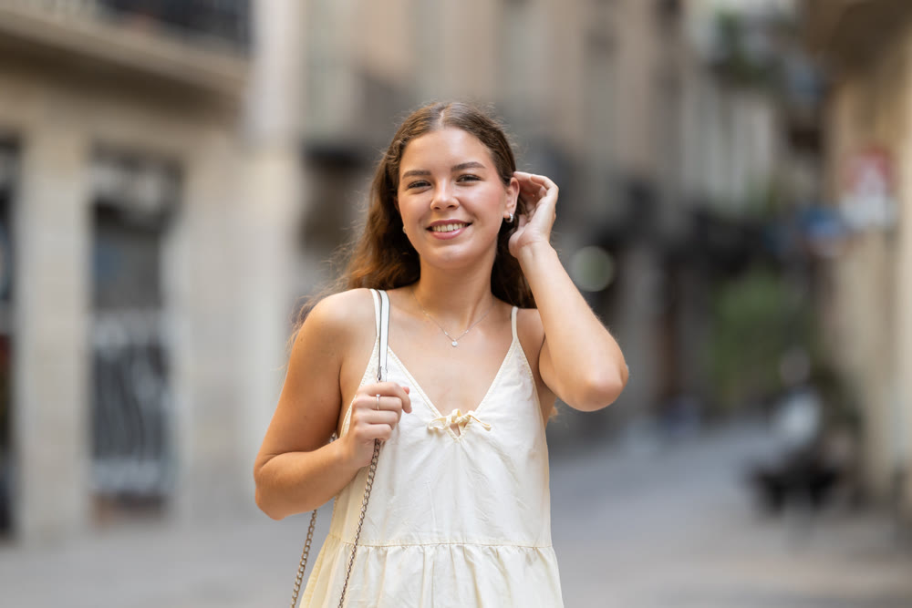 Young woman posing on city street
