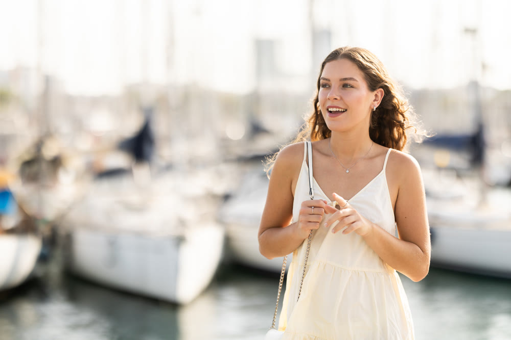Young woman posing at yacht port