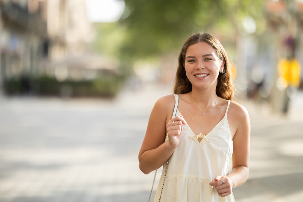 Young woman posing on city street