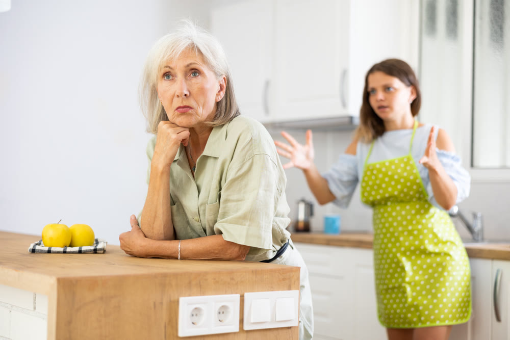 Offended old woman quarreling with her daughter at home
