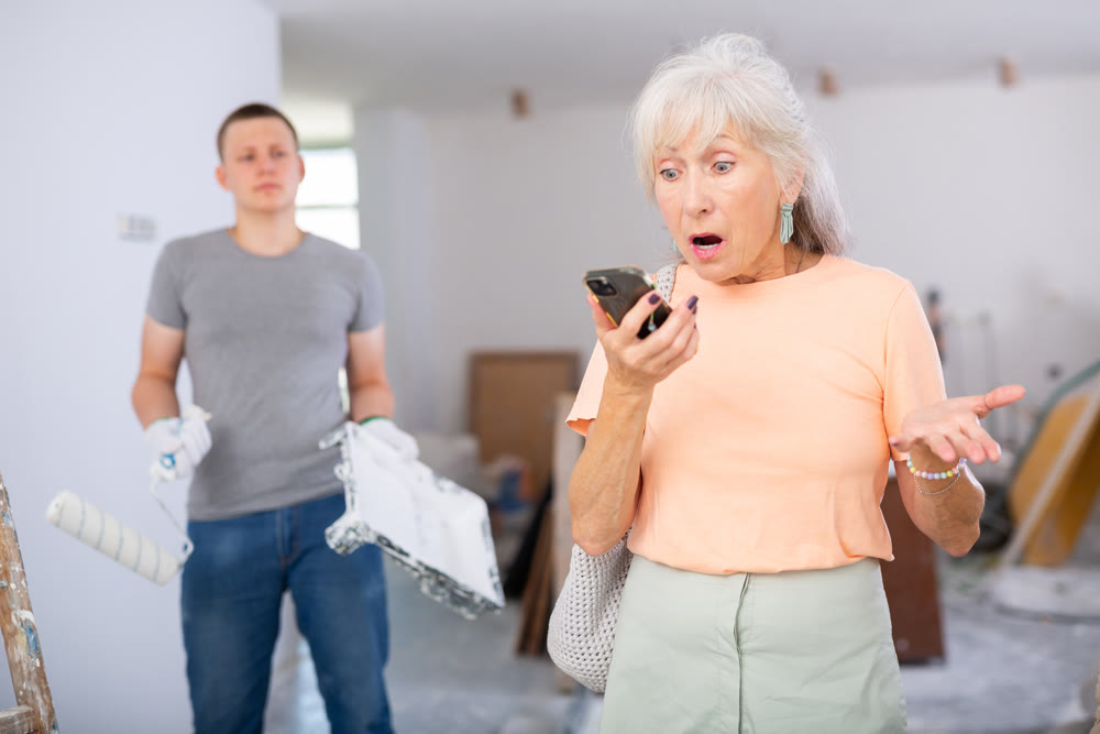 Emotional mature woman discusses current issues on a mobile phone