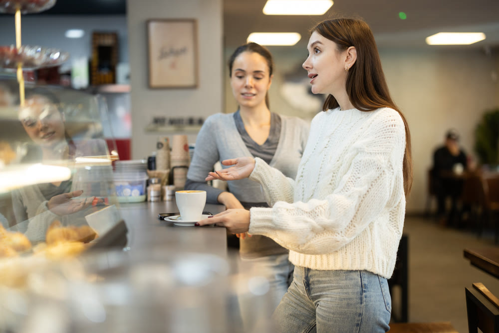Two female friends met in a cafe