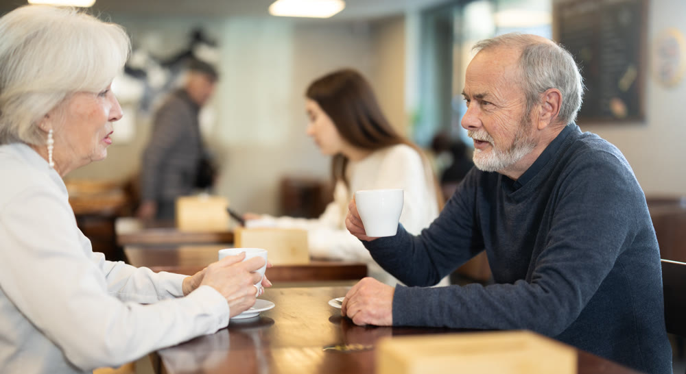 Mature couple spend time in cafe