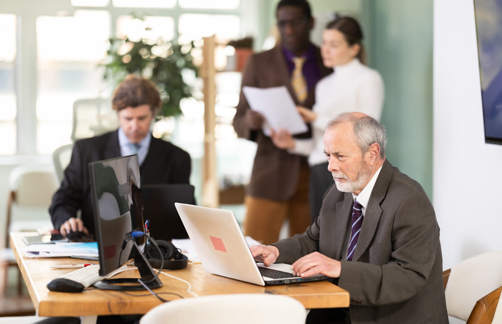 Office employee working with laptop or computer, negotiating, calling with partners