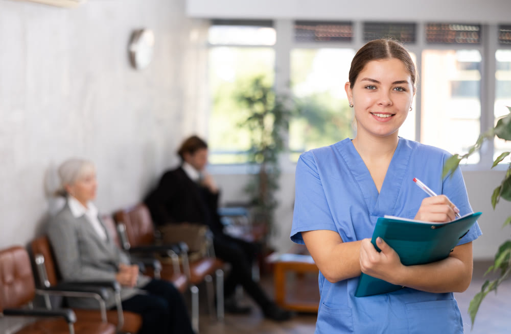 Young woman doctor makes notes in folder