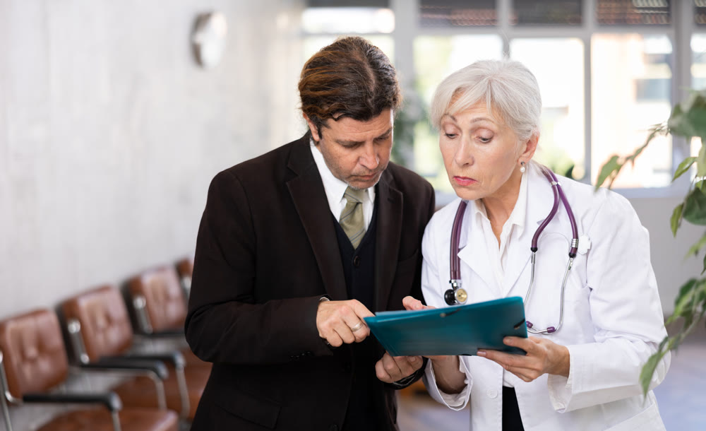 Man consults with a doctor about the diagnosis and treatment of disease
