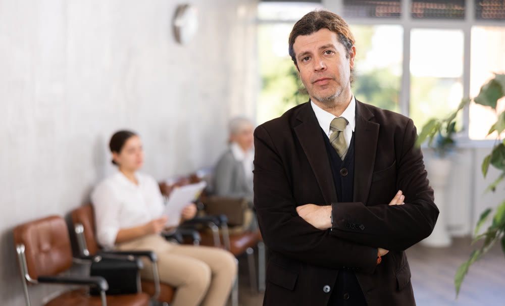 Portrait of confident senior male director in office