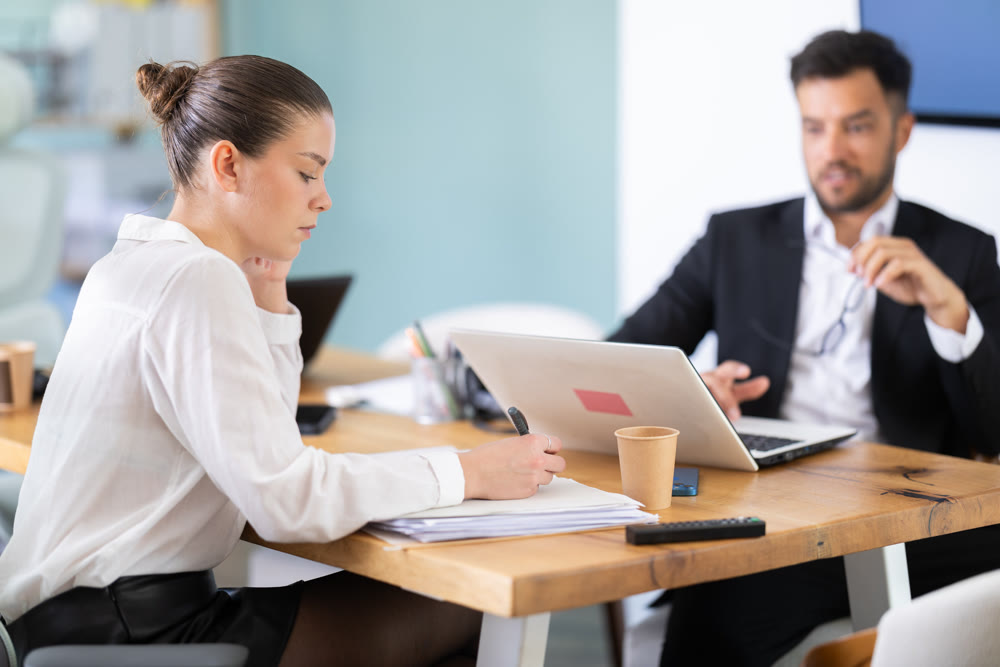 Man and woman working in office