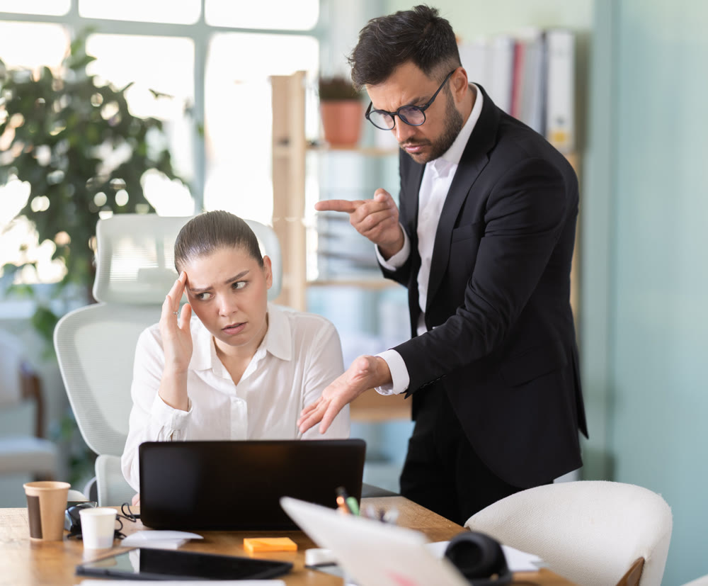 man, the head of a successful company, chastises an employee from the IT