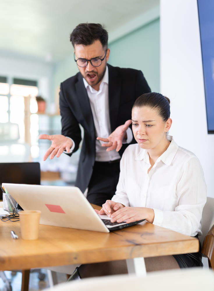 man, the head of a successful company, chastises an employee from the IT