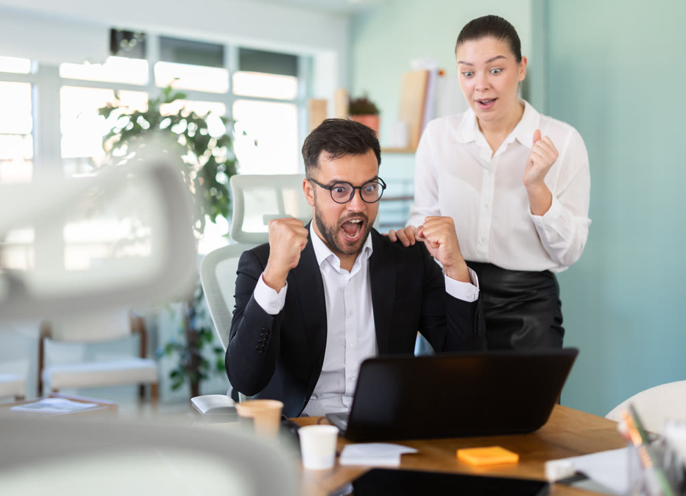Man and girl office employees is genuinely happy and elated