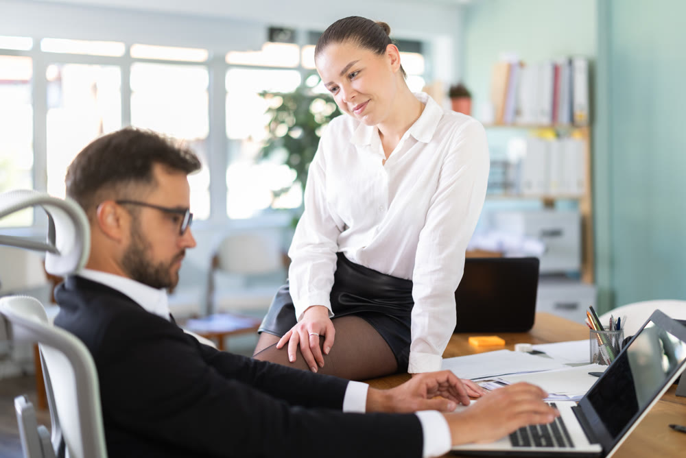 Girl harasses her male boss at work