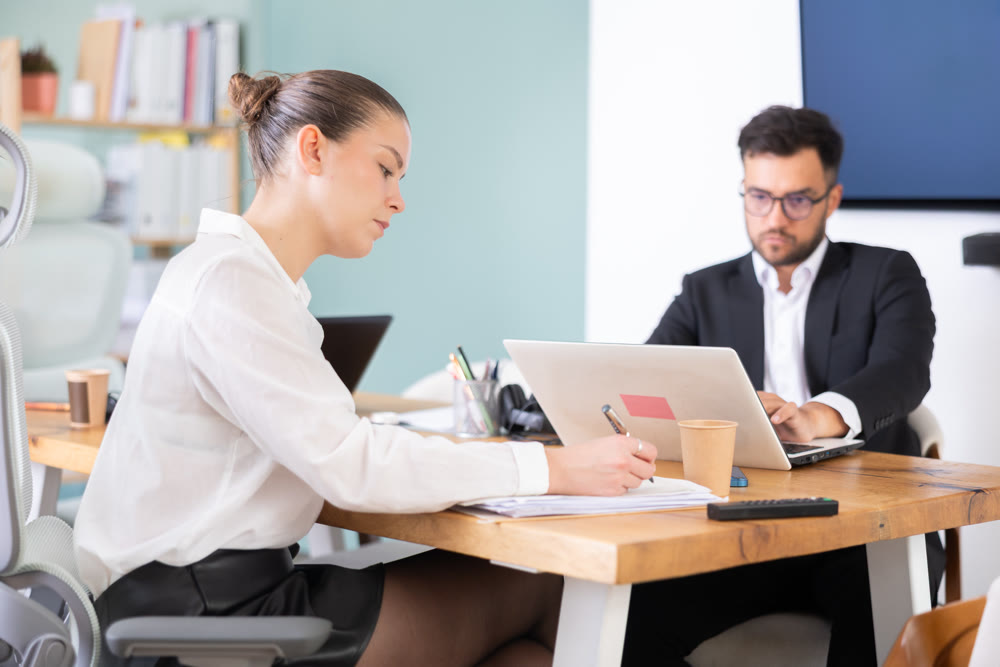 Man and woman working in office