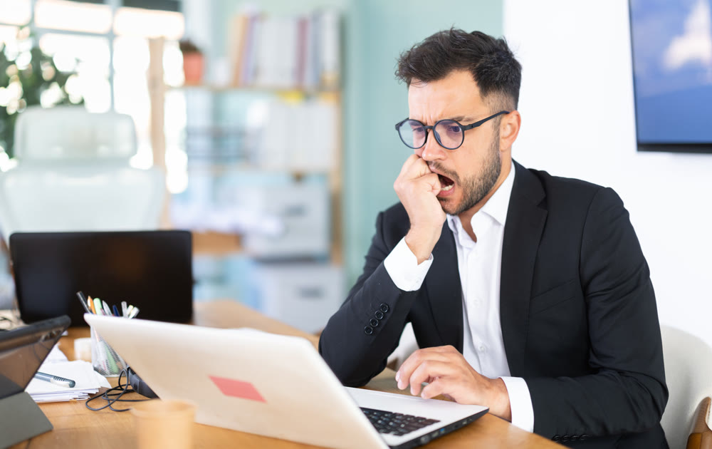 Man working in office, manager using laptop in work