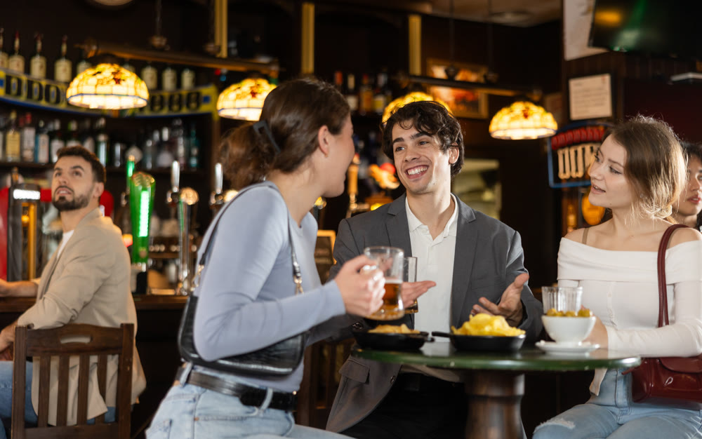 Young people spend time at bar