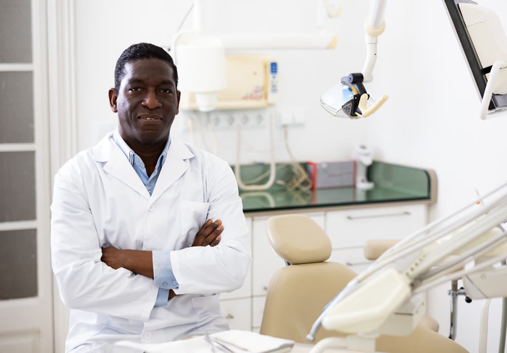 Positive african american dentist doctor in clinic