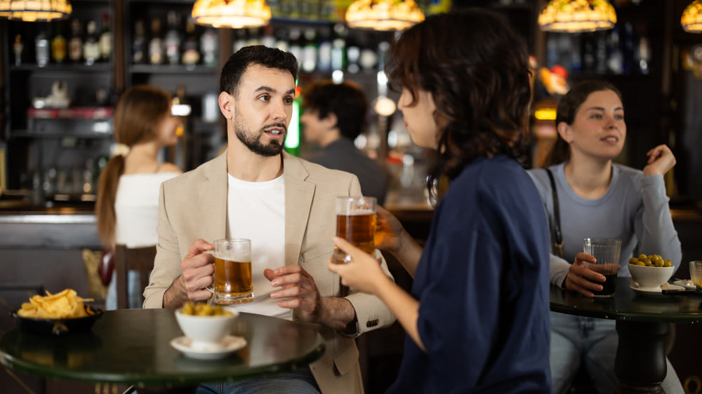 Couple in love is spending time at bar