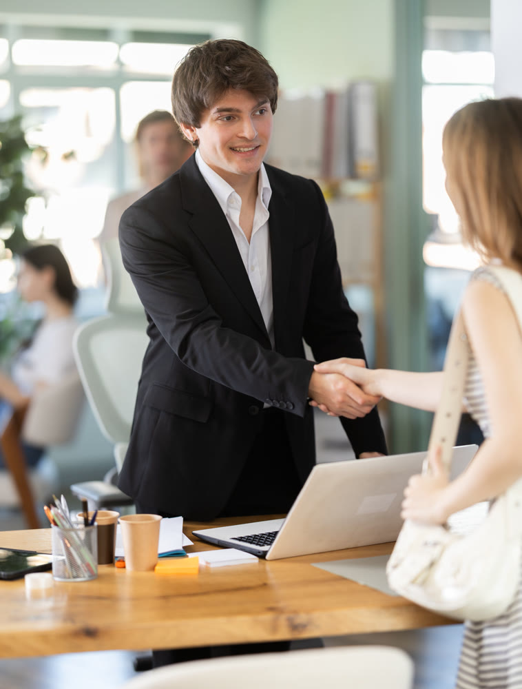 Bank manager talking with female client in office