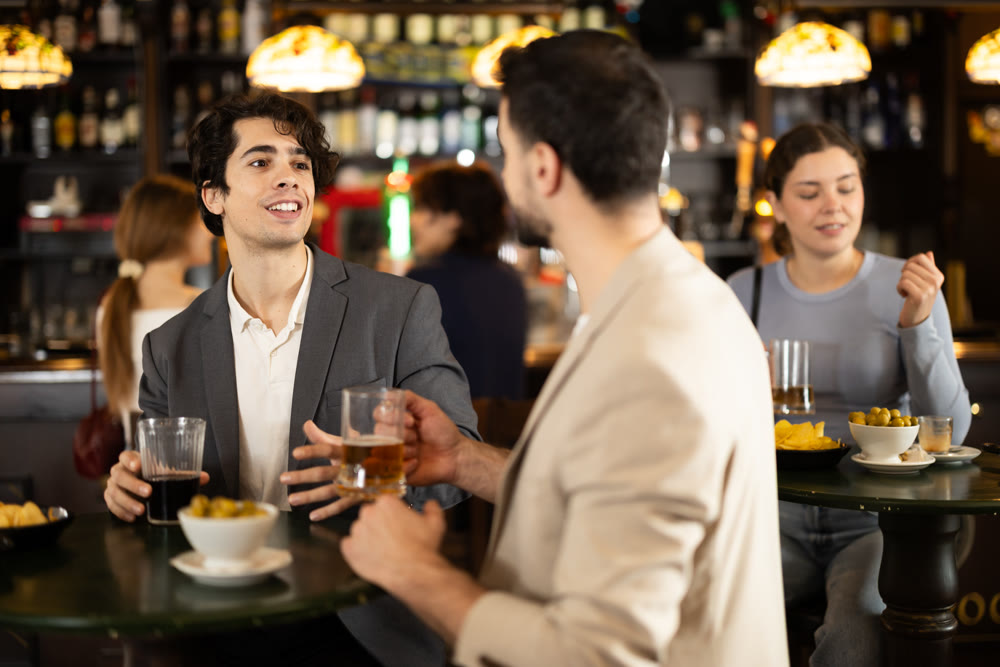 Youth guys gathering meeting in bar