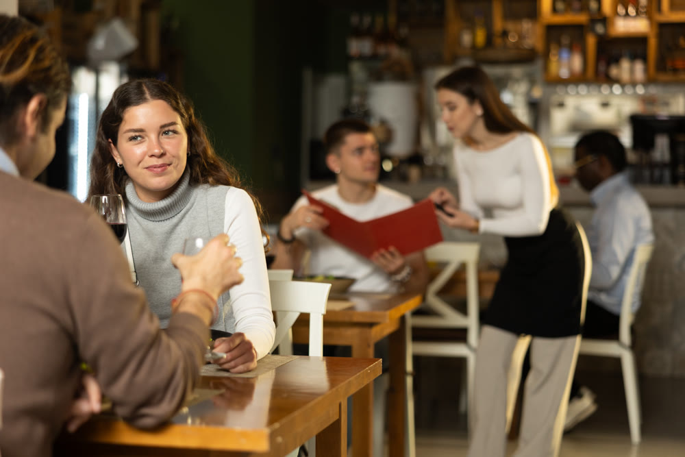 Woman talking to her husband in a restaurant
