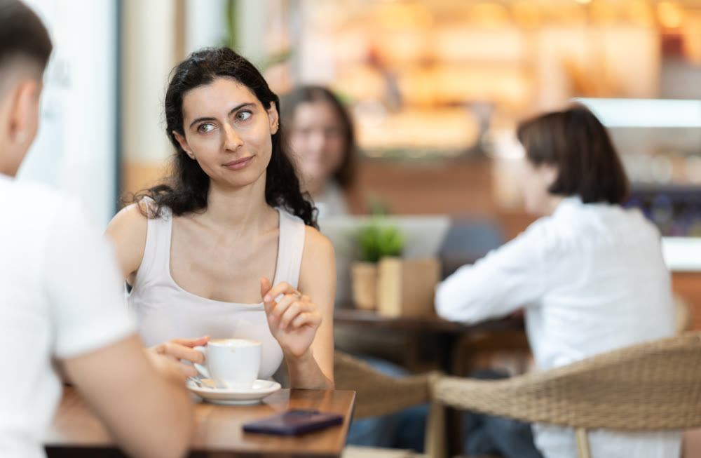 Couple young woman and man in cafe