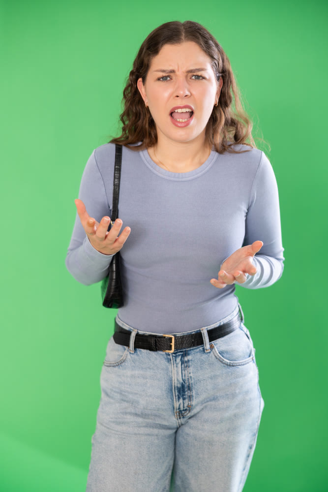 Aggressive woman expresses negative emotions by screaming and waving her arms. Chroma key compositing