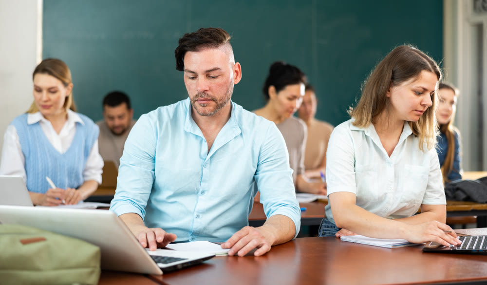 Concentrated students studying in the university auditorium