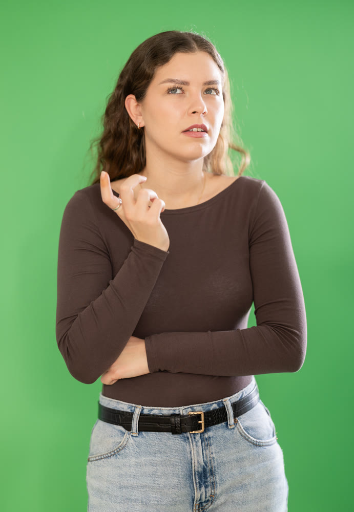 Discouraged or puzzled female person is trying to recall necessary information