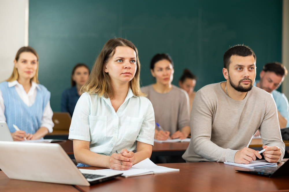Concentrated students studying in the university auditorium