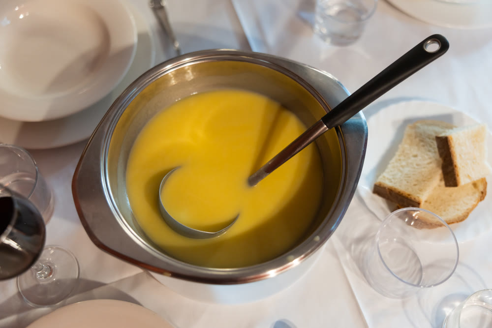 Creamy zucchini soup served with bread