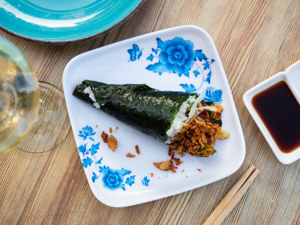 Maguro temaki - these are rolls made of rice wrapped in nori seaweed, with tuna, lettuce, cucumber, avocado, onions