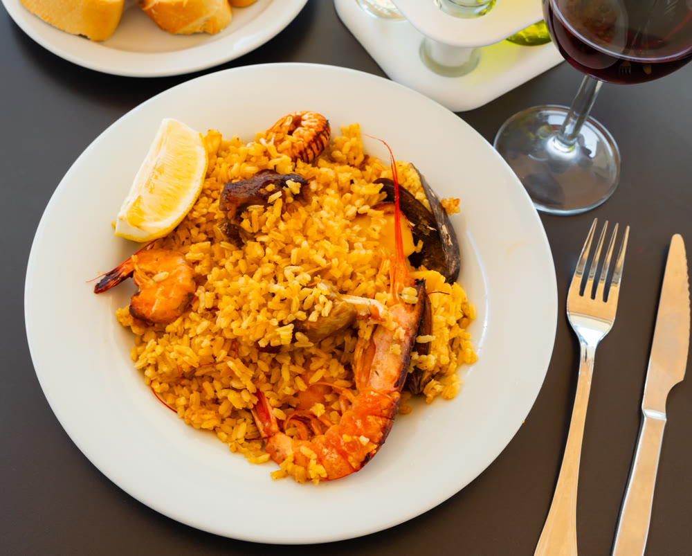 Traditional Spanish paella on a white plate