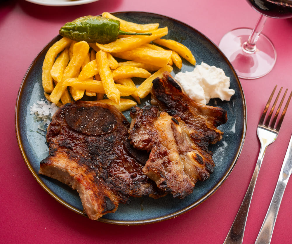 Grilled beef churrasco with roasted potatoes, peppers, and aioli