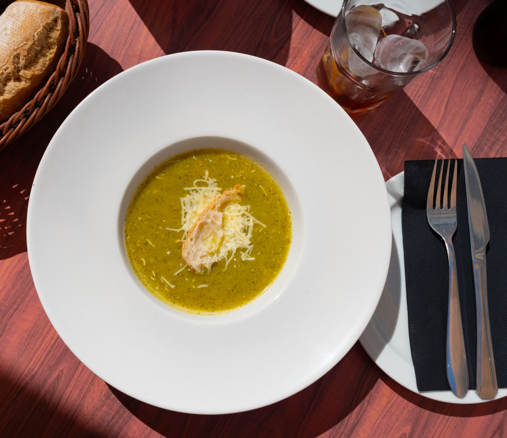 Creamy zucchini soup served with croutons