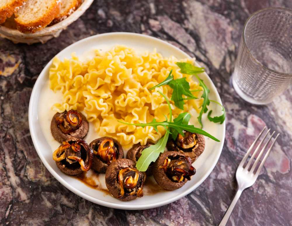 Pasta with fried mushrooms and spices top view