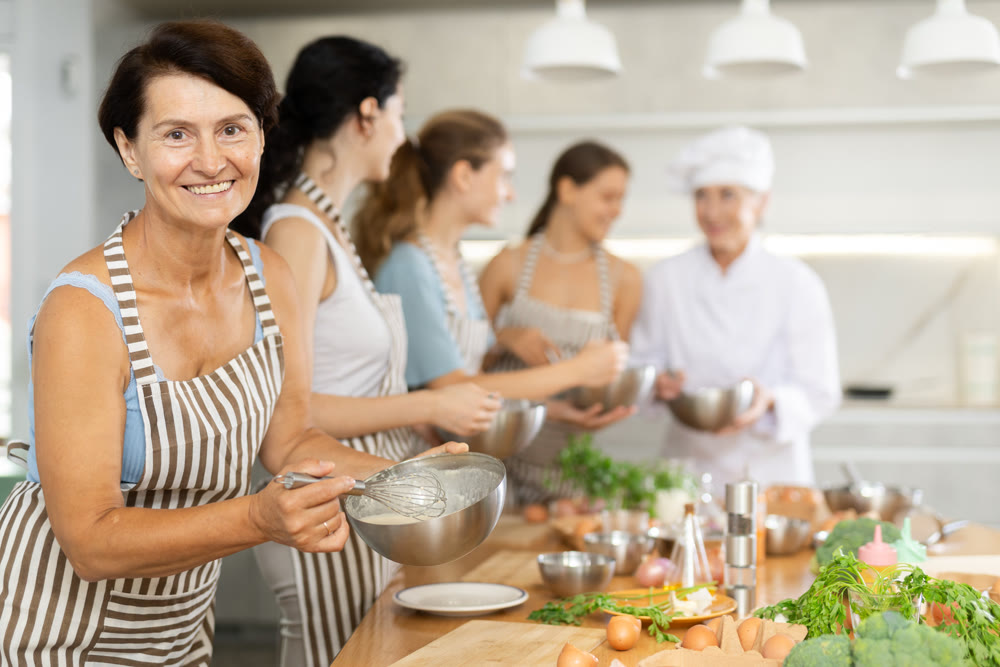 Mature woman holding bowl in her hands