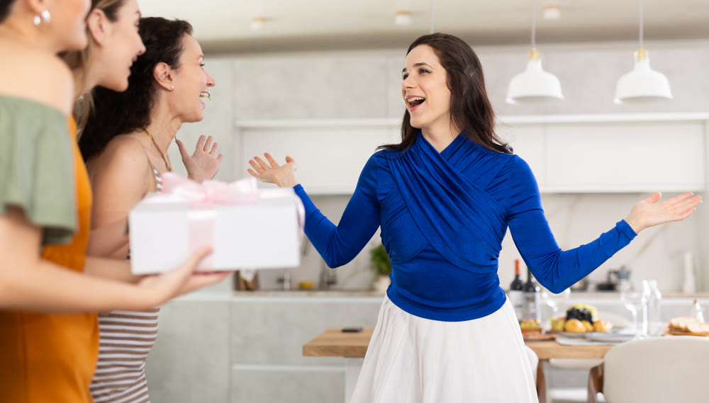 Happy women greeting each other before starting house party