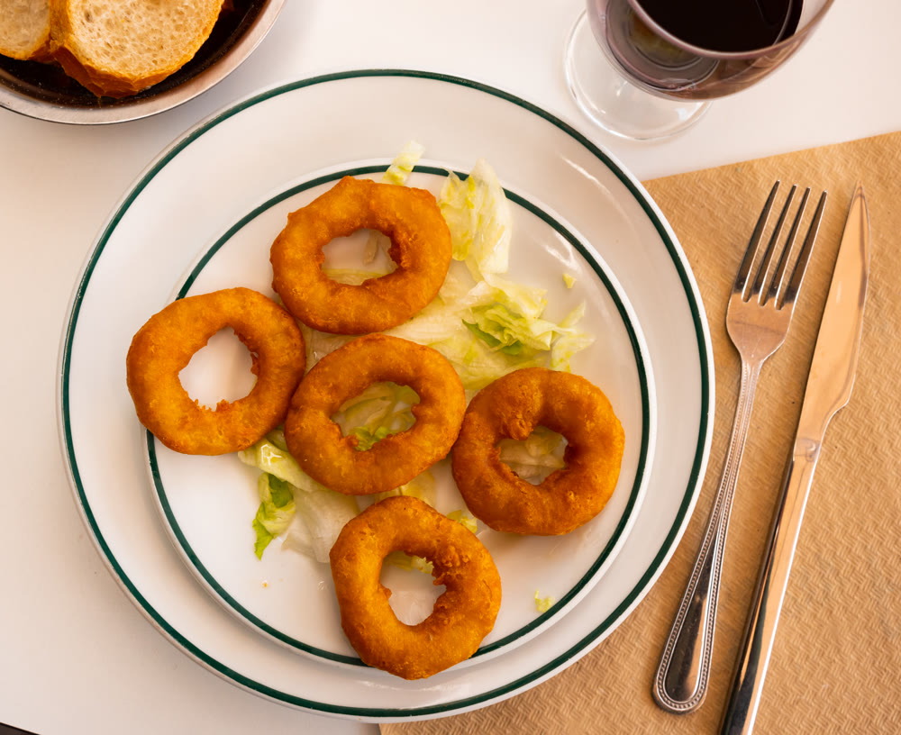 Calamares Andaluza, deep-fried coated squid rings on lettuce leaves