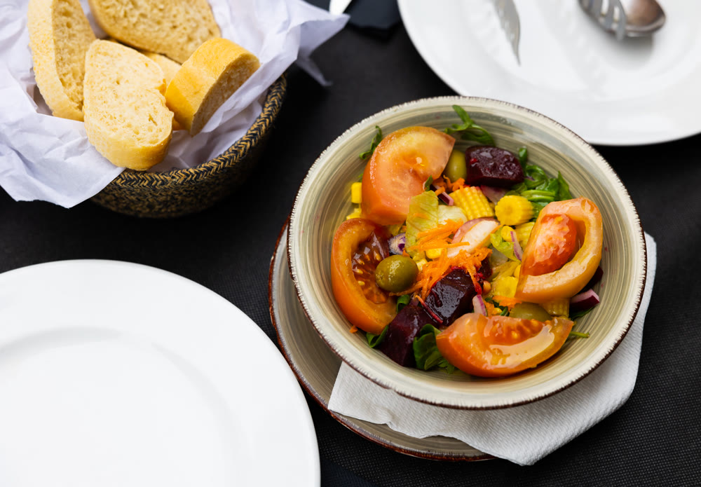 Portion of fresh salad in bowl