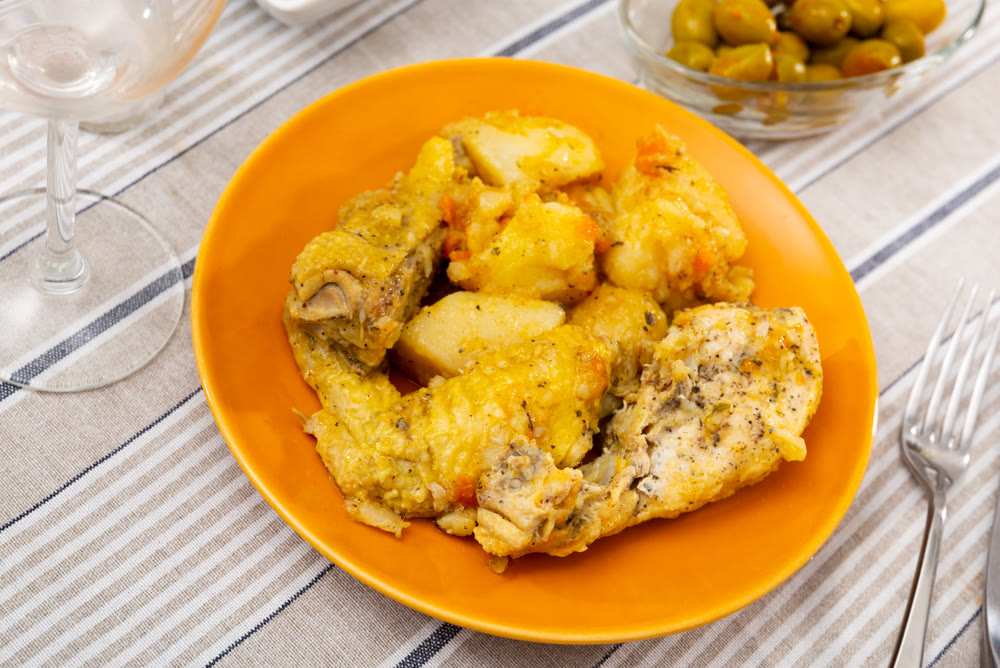Homemade roasted chicken served with stewed potatoes
