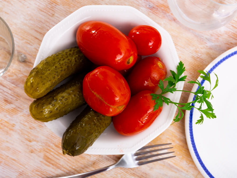 Appetizing pickled cucumbers and tomatoes