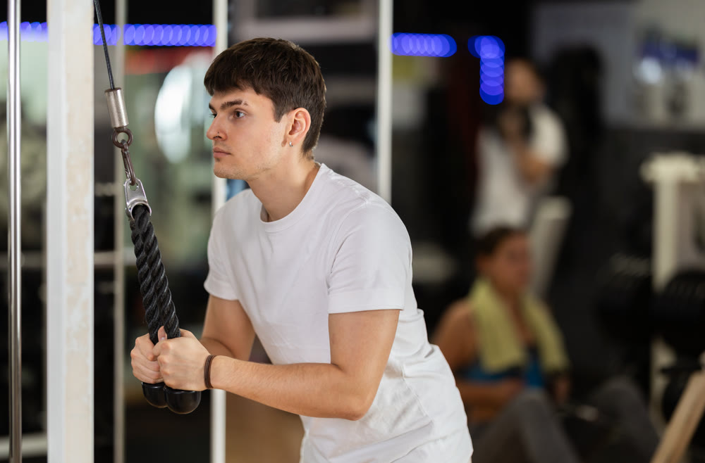 Guy doing triceps exercise