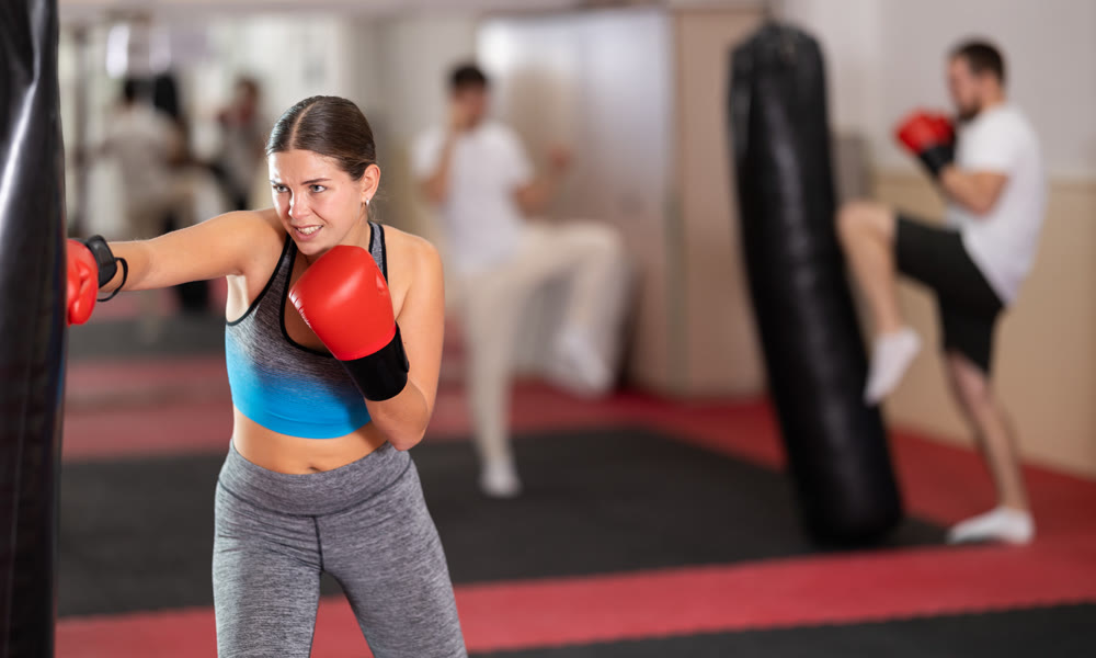 Woman training in boxing section