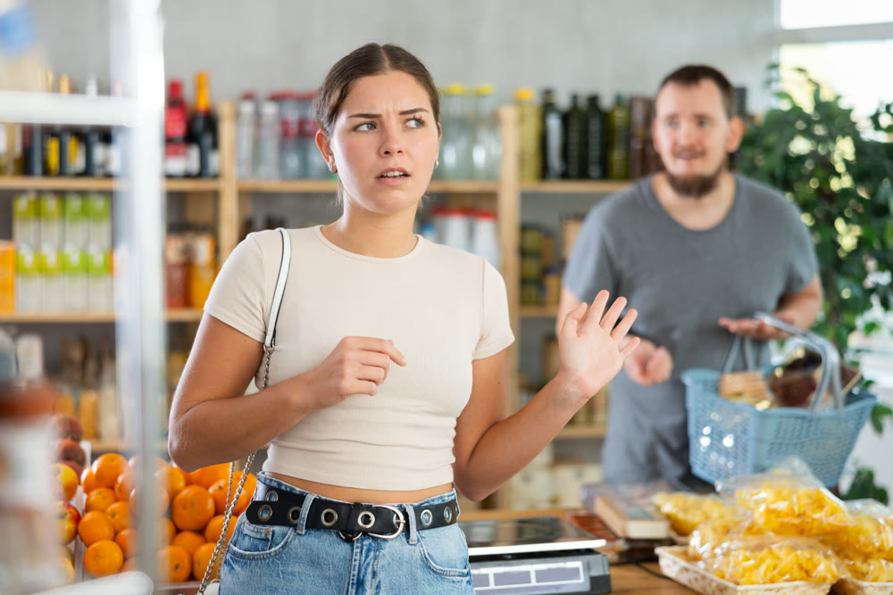 Family quarrel between a husband and wife in grocery supermarket