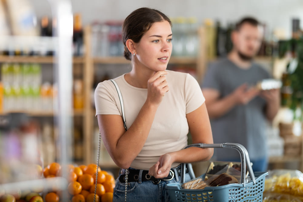 Young woman choosing products