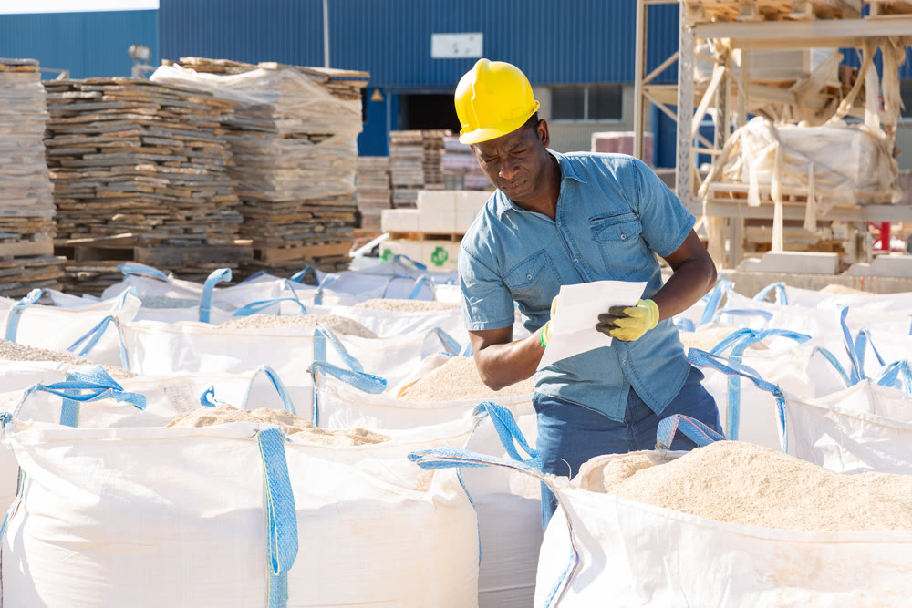 Manager keeps records of sandbags in the open area of hardware store