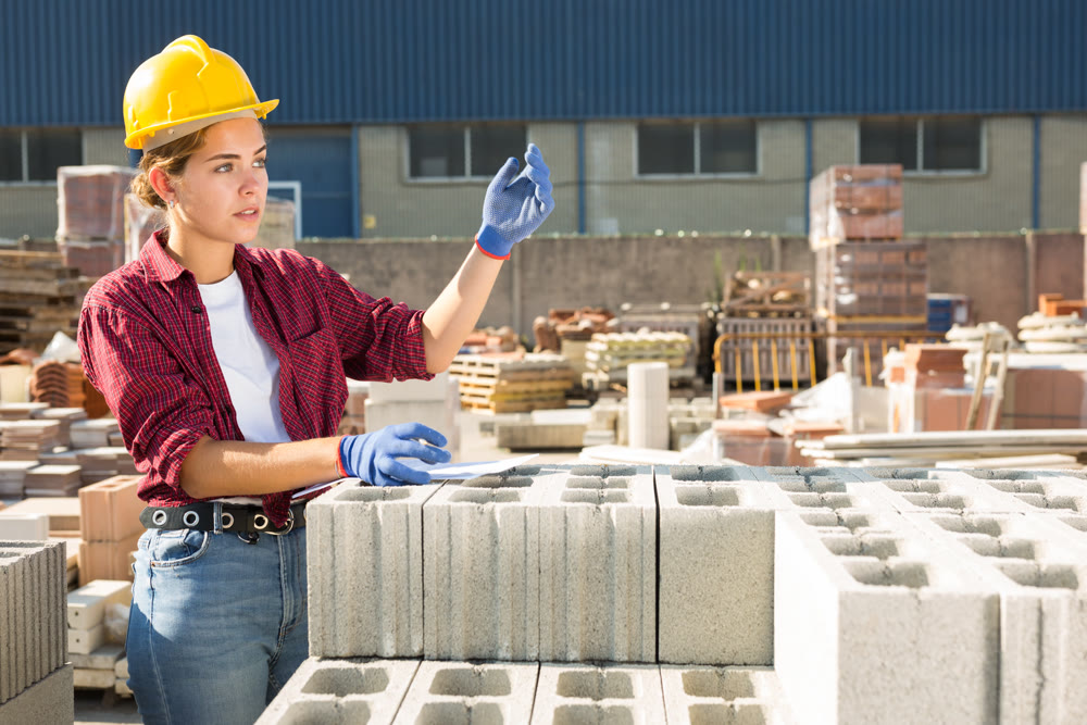 Female worker beckoning come here at construction store